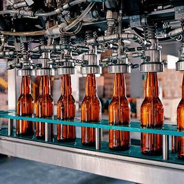 A manufacturing line of glass bottles at a beverage plant is a reminder of how alkalinity can effect final taste and quality of products.